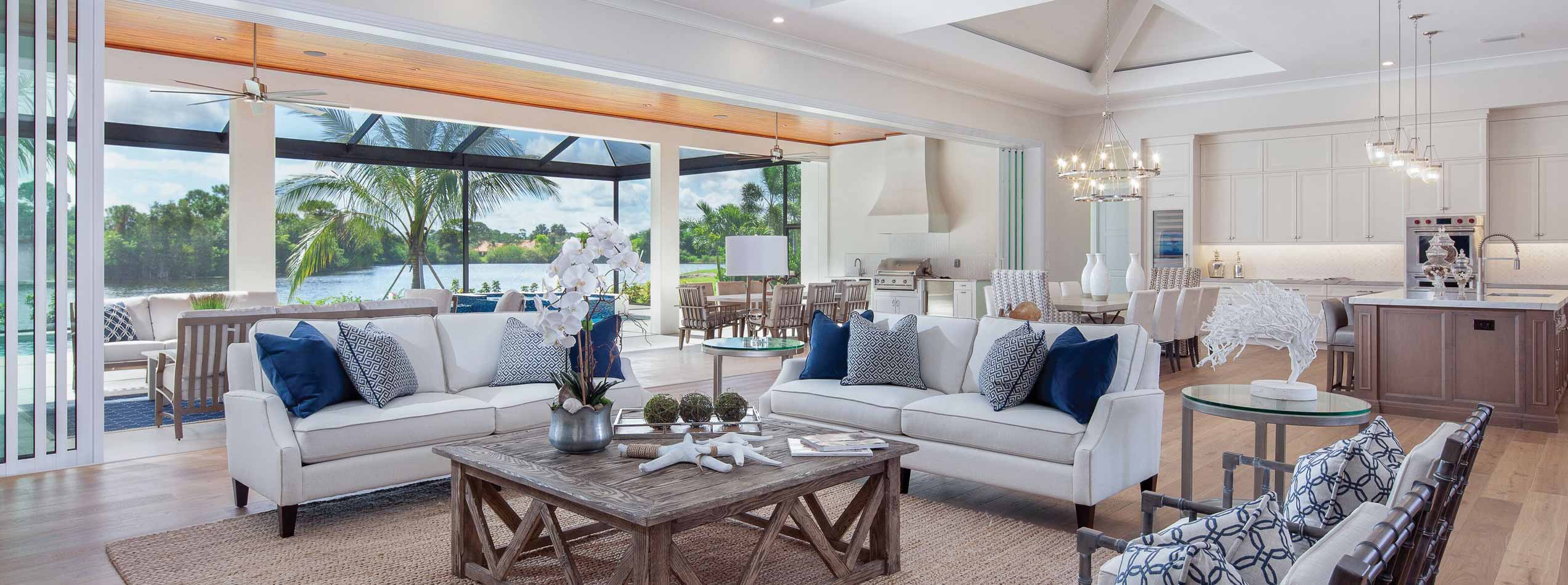 Livingroom Kitchen Combination In Front Of The Pool | Riverview Homes Naples Florida Luxury Home Builders